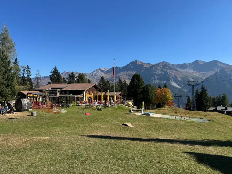 Pradaschier mountain restaurant with play meadow and mountain panorama